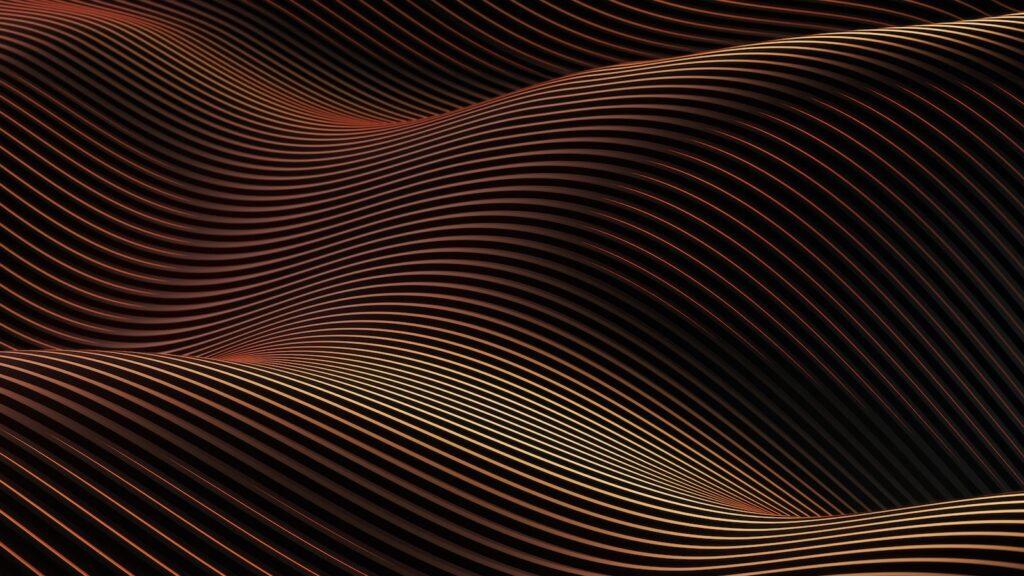 a black and orange background with wavy lines